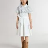 Abito chemisier da bambina in tela di cotone bianca con stampa nautica blu e bordino bianco