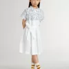 Abito chemisier da bambina in tela di cotone bianca con stampa nautica blu e bordino bianco