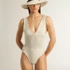 Body da donna in cotone bianco lavorato all’uncinetto