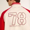 Bomber in cotone bianco e rosso consumato con ricami