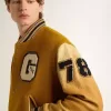 Bomber in lana giallo ocra con maniche in pelle