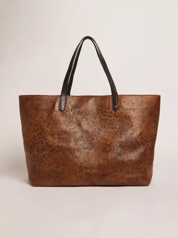 Borsa Pasadena in pelle martellata con stampa leopardata e manici neri a contrasto Borsa Pasadena in pelle martellata con stampa leopardata e manici neri a contrasto