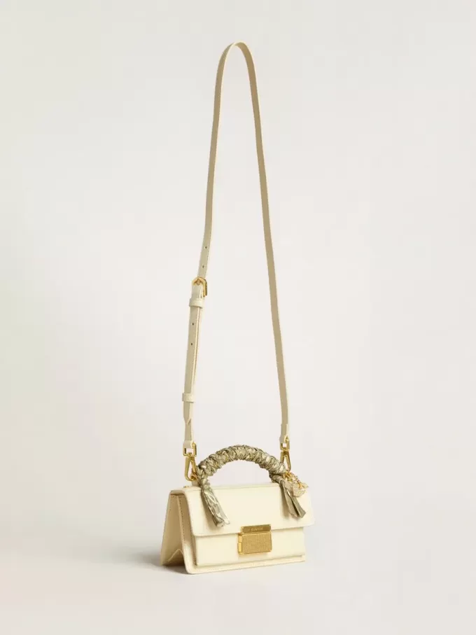 Borsa Venezia piccola in pelle color burro con sciarpa intrecciata e doppio ciondolo Borsa Venezia piccola in pelle color burro con sciarpa intrecciata e doppio ciondolo
