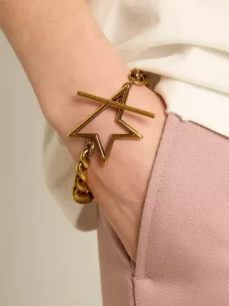 Bracciale con catena a maglie decrescenti in oro antico e chiusura a forma di stella