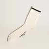 Calze lunghe a coste in bianco vintage con striscia nera