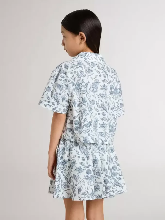 Camicia corta bianca da bambina con stampa blu Camicia corta bianca da bambina con stampa blu