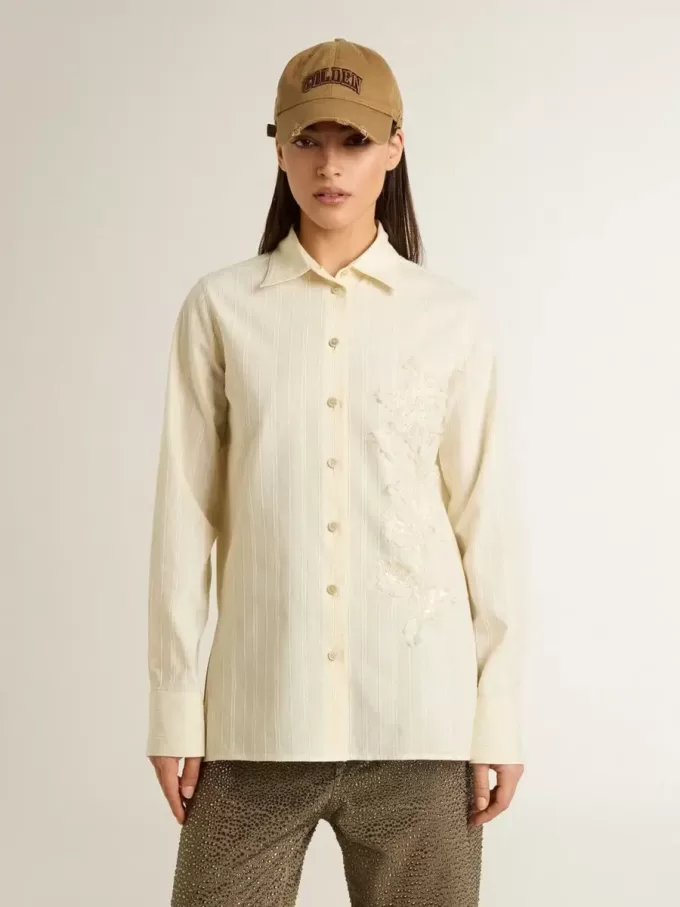 Camicia da donna in cotone color crema con ricami floreali Camicia da donna in cotone color crema con ricami floreali