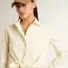 Camicia da donna in cotone color crema con ricami floreali Camicia da donna in cotone color crema con ricami floreali