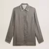 Camicia da donna in misto viscosa e seta verde con motivo floreale Camicia da donna in misto viscosa e seta verde con motivo floreale