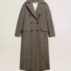 Cappotto lungo da donna con motivo a spina di pesce e dettagli gialli Cappotto lungo da donna con motivo a spina di pesce e dettagli gialli
