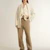 Cardigan da donna in cotone color crema con ricami floreali Cardigan da donna in cotone color crema con ricami floreali