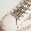 Chiusura in pizzo con clip a stella color oro antico