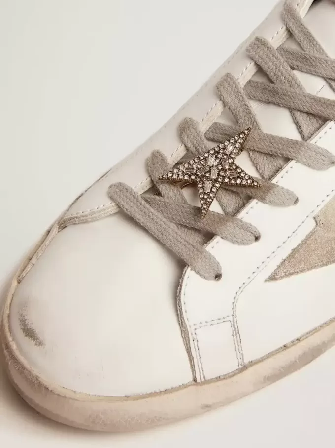 Chiusura in pizzo con clip a stella color oro antico