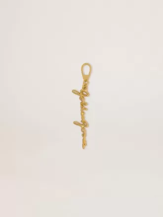 Ciondolo in ottone color oro con firma Golden Goose