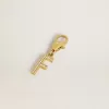 Ciondolo lettera F in ottone color oro con cristalli Ciondolo lettera F in ottone color oro con cristalli