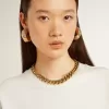 Collana con catena decrescente in oro antico e chiusura a forma di stella