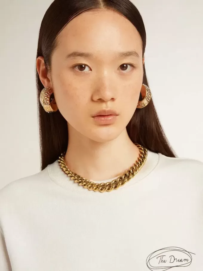 Collana con catena decrescente in oro antico e chiusura a forma di stella