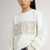 Felpa bianca da bambina con scritta multicolore Golden sul davanti Felpa bianca da bambina con scritta multicolore Golden sul davanti