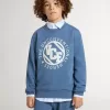 Felpa blu da bambino con toppe bianche in rilievo Felpa blu da bambino con toppe bianche in rilievo