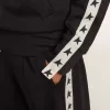Felpa blu scuro con zip, striscia bianca e stelle a contrasto Felpa blu scuro con zip, striscia bianca e stelle a contrasto