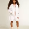 Felpa con zip da bambina in bianco con stelle glitterate sulle maniche