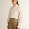 Felpa corta da donna in cotone color crema con cristalli sul davanti