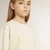Felpa da bambina color crema con scritta patch