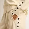 Felpa da donna bianca con zip, striscia bianca e stelle nere Felpa da donna bianca con zip, striscia bianca e stelle nere