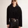 Felpa da donna in ciniglia nera con ricamo sul retro