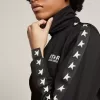 Felpa da donna nera con zip e stelle bianche