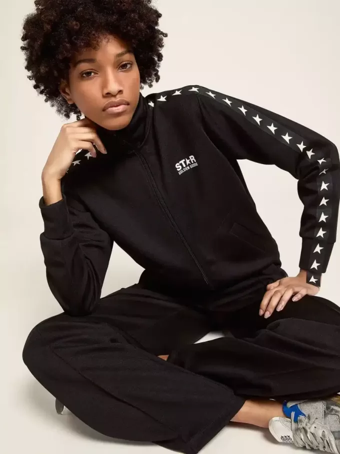 Felpa da donna nera con zip e stelle bianche
