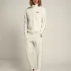 Pantaloni jogging da uomo bianchi con stelle nere sui lati Pantaloni jogging da uomo bianchi con stelle nere sui lati