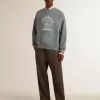 Felpa oversize in azzurro con finitura effetto consumato