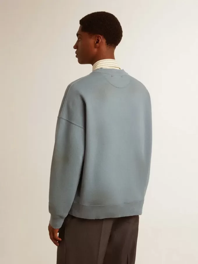 Felpa oversize in azzurro con finitura effetto consumato