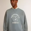 Felpa oversize in azzurro con finitura effetto consumato
