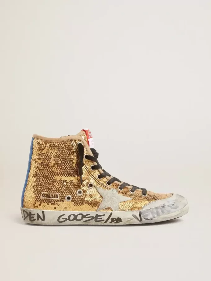 Francy Penstar in paillettes dorate con stella in camoscio e linguetta blu brillante sul tallone Francy Penstar in paillettes dorate con stella in camoscio e linguetta blu brillante sul tallone