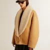 Giacca da donna in pelle di montone con ampio collo a scialle in shearling