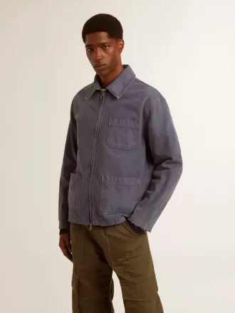 Giacca da uomo blu in cotone denim con trattamento effetto consumato