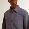 Giacca da uomo blu in cotone denim con trattamento effetto consumato Giacca da uomo blu in cotone denim con trattamento effetto consumato