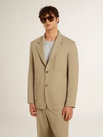 Giacca monopetto da uomo beige gessata con vestibilità oversize Giacca monopetto da uomo beige gessata con vestibilità oversize
