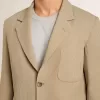 Giacca monopetto da uomo beige gessata con vestibilità oversize Giacca monopetto da uomo beige gessata con vestibilità oversize