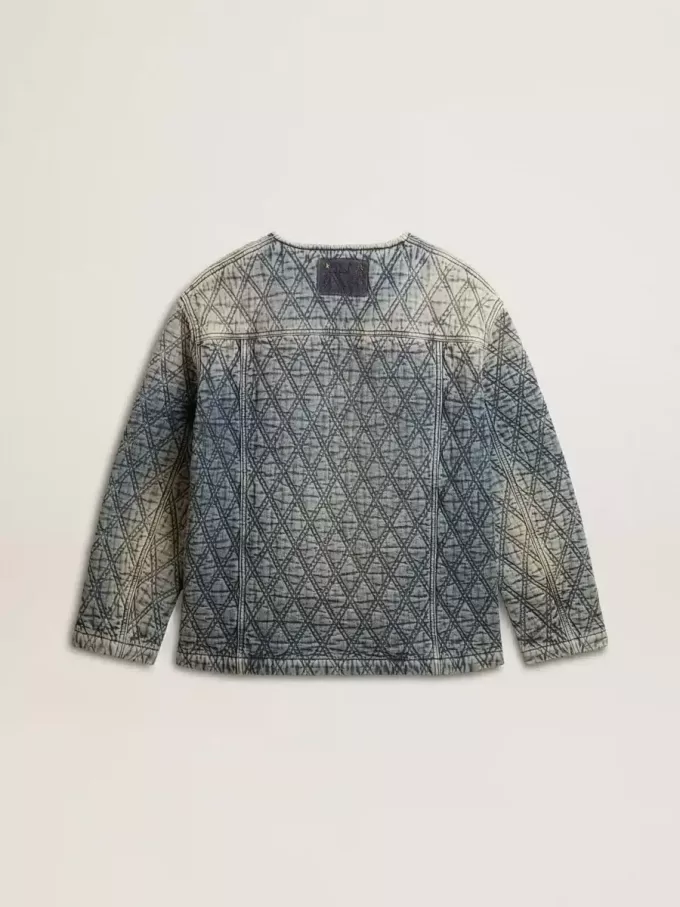 Giacca trapuntata da donna in denim di cotone blu con finitura effetto consumato Giacca trapuntata da donna in denim di cotone blu con finitura effetto consumato