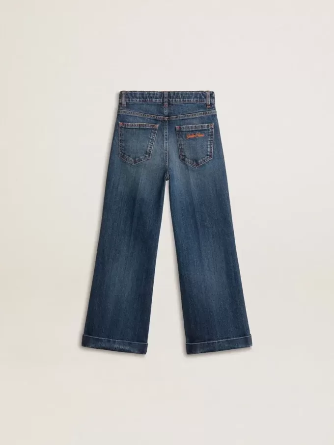 Jeans bootcut da bambina con lavaggio medio e ricami