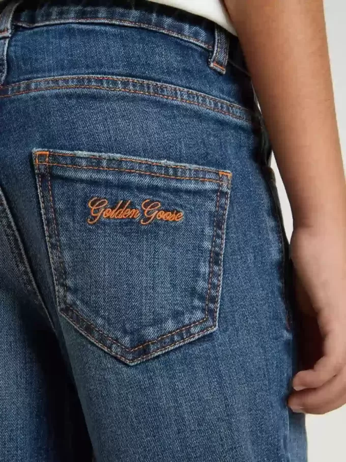 Jeans da bambino in denim con bordi grezzi e ricami