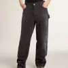 Jeans da donna in cotone nero effetto consumato con toppe frontali