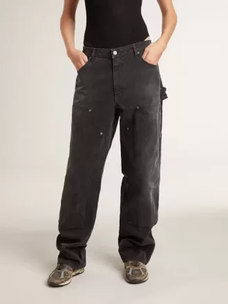 Jeans da donna in cotone nero effetto consumato con toppe frontali
