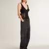 Jeans da donna in cotone nero effetto consumato con toppe frontali