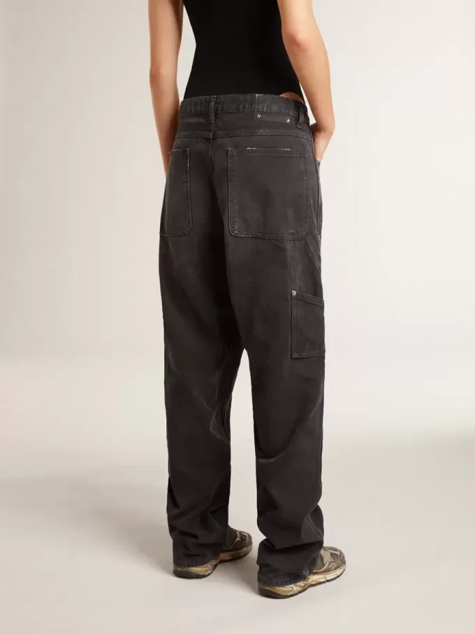 Jeans da donna in cotone nero effetto consumato con toppe frontali