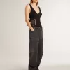 Jeans da donna in cotone nero effetto consumato con toppe frontali