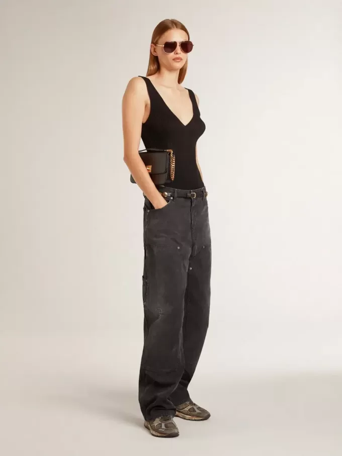 Jeans da donna in cotone nero effetto consumato con toppe frontali